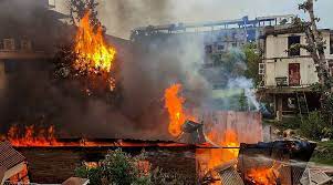 Manipur violence: Furious mob sets fire to police armoury, f...