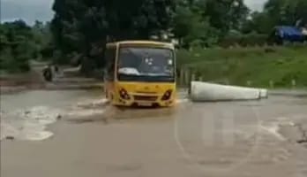 Video of school bus carrying children through overflowing drain goes viral
