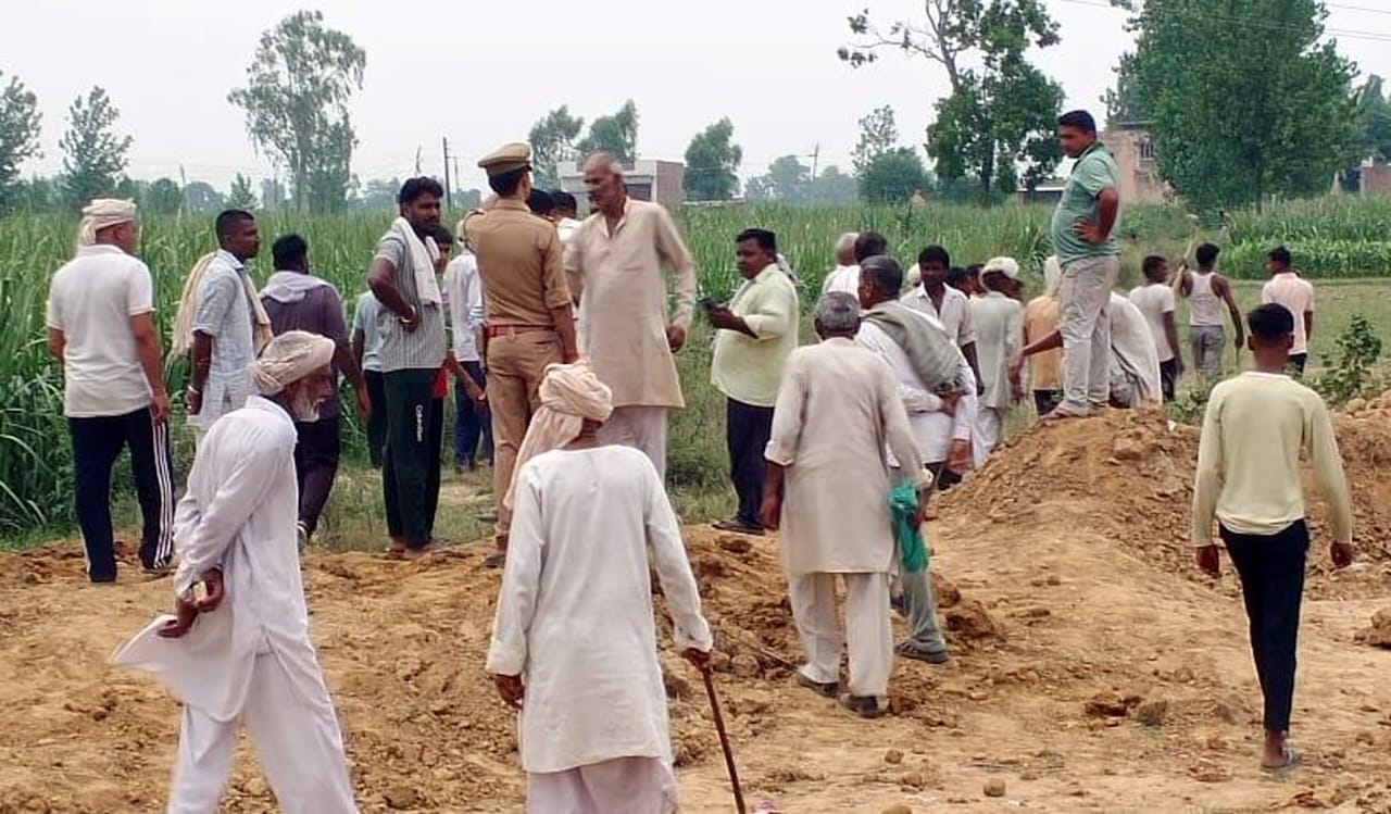 Two parties came face to face in the ongoing dispute over draining dirty water from the graveyard land