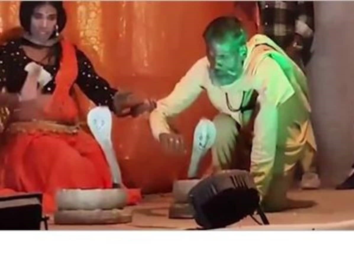 The artist was dancing with a poisonous snake